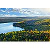 Fall forest and lake with colorful trees from above in Algonquin Park, Canada