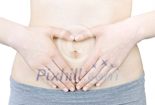 Woman showing heart shape with her hands on stomach Woman showing heart shape with her hands on stomach