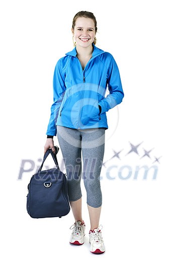 Smiling fit young woman with gym bag standing ready for fitness exercise Smiling fit young woman with gym bag standing ready for fitness exercise
