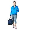 Smiling fit young woman with gym bag standing ready for fitness exercise