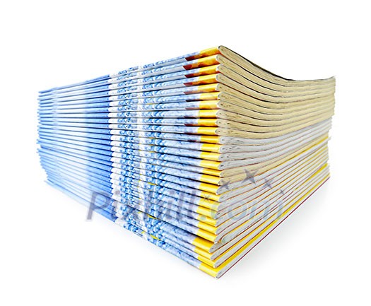 Many magazines stacked in a pile isolated on white Many magazines stacked in a pile isolated on white
