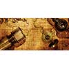 Old vintage retro compass and spyglass on ancient world map. Vintage still life. Travel geography navigation concept background.