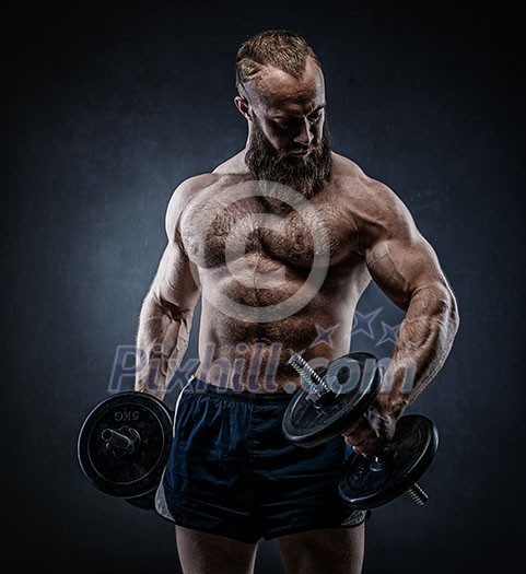 Strong bodybuilder with six pack, perfect abs, shoulders, biceps, triceps and chest. Power athletic bearded man in training pumping up muscles with dumbbell. Strong bodybuilder with six pack, perfect abs, shoulders, biceps, triceps and chest. Power athletic bearded man in training pumping up muscles with dumbbell.