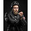 Angry Bearded Biker Man in Leather Jacket and Helmet over Black Background