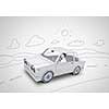 Young man driving car made of sheet of paper