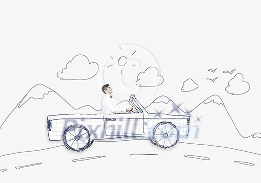 Young man driving car made of sheet of paper Young man driving car made of sheet of paper