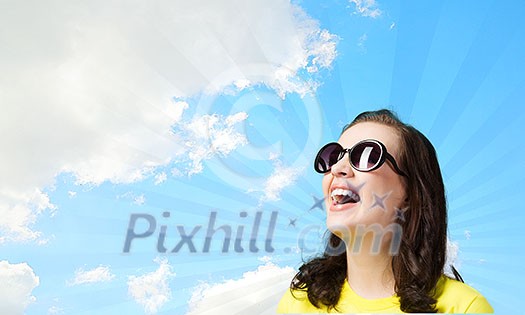 Young girl teenager in sunglasses and yellow shirt Young girl teenager in sunglasses and yellow shirt