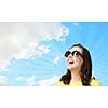 Young girl teenager in sunglasses and yellow shirt