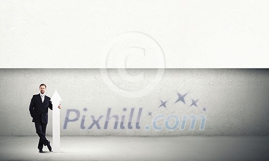 Businessman in suit with white blank arrow in hands Businessman in suit with white blank arrow in hands