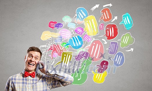 Young man with mobile phone and colorful chat icons