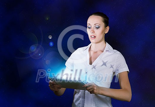 Young pretty surprised woman using tablet pc Young pretty surprised woman using tablet pc