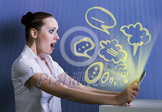 Young pretty surprised woman using tablet pc Young pretty surprised woman using tablet pc