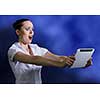 Young pretty surprised woman using tablet pc