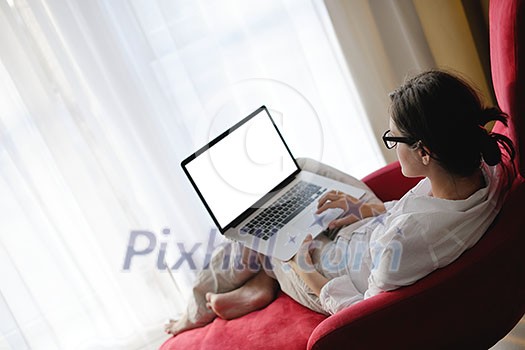 woman working on laptop computer and relax at modern home woman working on laptop computer and relax at modern home
