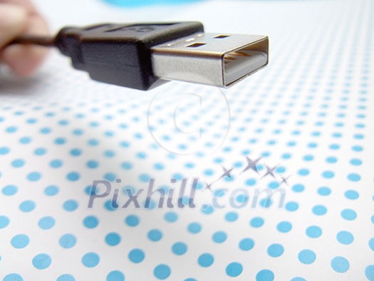 usb cable on dotted background usb cable on dotted background
