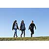 group of teen people woman  have fun outdoor with blue sky in background