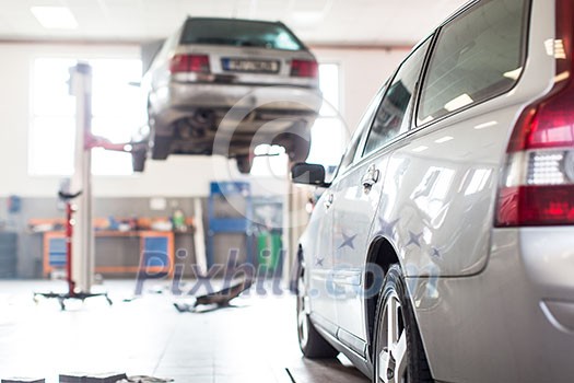 Cars in a garage (shallow DOF; color toned image) Cars in a garage (shallow DOF; color toned image)