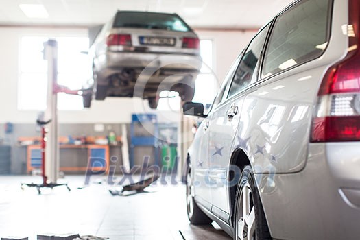 Cars in a garage (shallow DOF; color toned image)