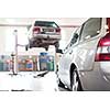 Cars in a garage (shallow DOF; color toned image)