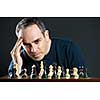 Chessboard with man thinking about chess strategy