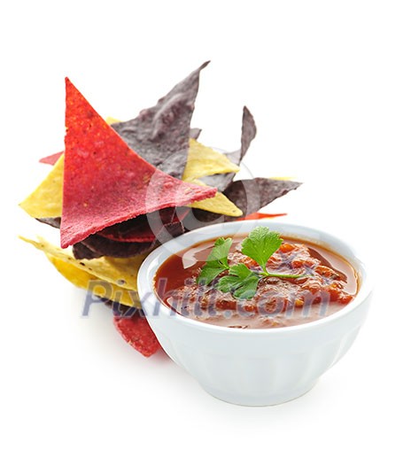Bowl of salsa with colorful tortilla chips isolated on white background Bowl of salsa with colorful tortilla chips isolated on white background