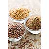 Bowls of whole and ground flax seed or linseed