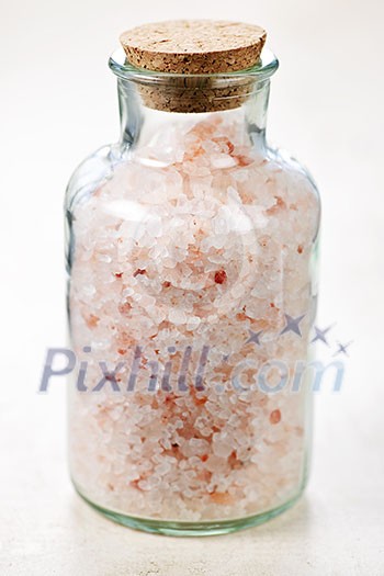Pink bath salts in a glass jar Pink bath salts in a glass jar