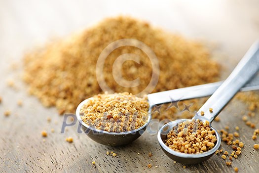 Organic coconut palm sugar in measuring spoons Organic coconut palm sugar in measuring spoons