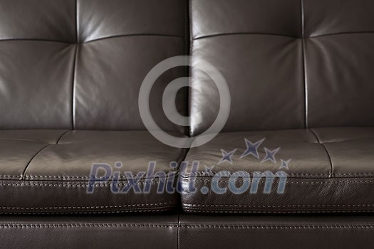 Closeup of luxurious expensive brown leather couch Closeup of luxurious expensive brown leather couch