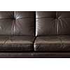 Closeup of luxurious expensive brown leather couch