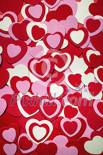 Heart background for Valentine's day made with pink and red hearts