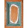 Old distressed wood door panel with peeling paint as framed background