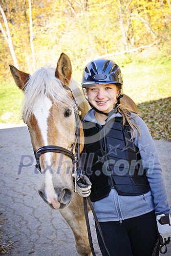 Portrait of teenage girl with horse outdoors on sunny day Portrait of teenage girl with horse outdoors on sunny day