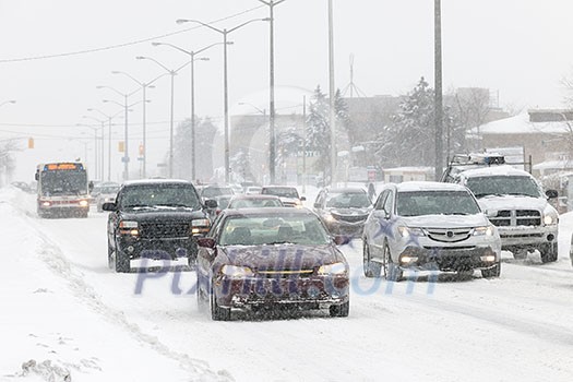 Cars driving on slippery road during heavy snowfall in Toronto Cars driving on slippery road during heavy snowfall in Toronto