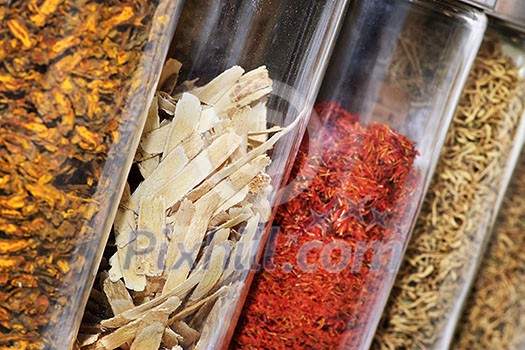 Traditional chinese medicine herbs and remedies in jars Traditional chinese medicine herbs and remedies in jars