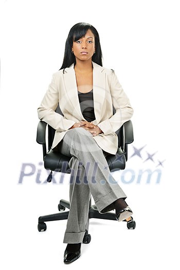 Black woman business manager sitting in leather office chair Black woman business manager sitting in leather office chair