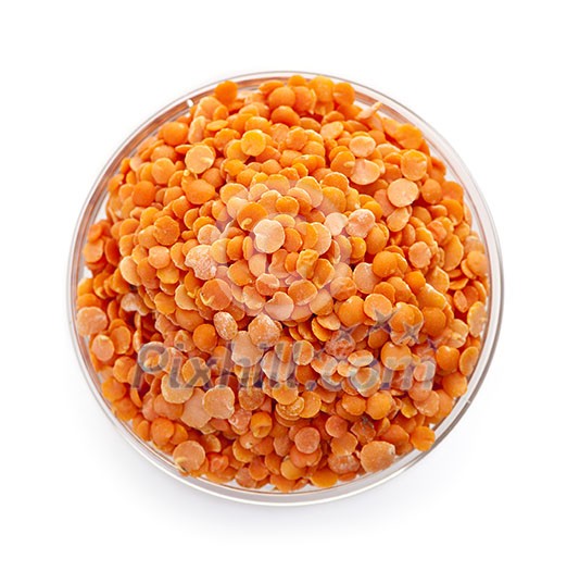 Bowl of uncooked red lentils from above isolated on white background Bowl of uncooked red lentils from above isolated on white background