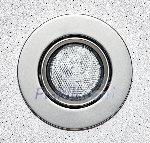 Closeup of pot light recessed lighting in ceiling tile Closeup of pot light recessed lighting in ceiling tile