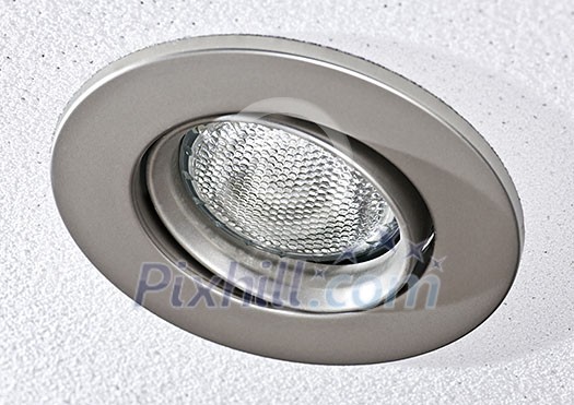 Closeup of pot light recessed lighting in ceiling tile Closeup of pot light recessed lighting in ceiling tile
