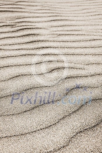 Natural background of sand in ripple wave pattern Natural background of sand in ripple wave pattern