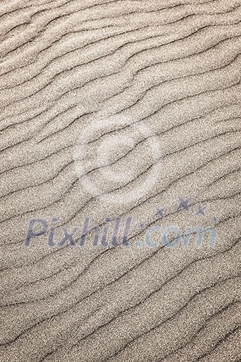 Natural background of sand in ripple wave pattern Natural background of sand in ripple wave pattern