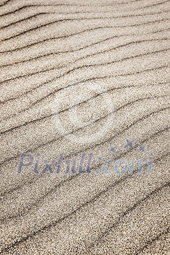 Natural background of sand in ripple wave pattern Natural background of sand in ripple wave pattern