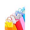 Many colorful shopping bags on white background