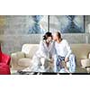 happy young couple relax at modern home living room indoor