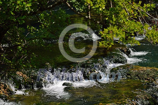 waterfall with clean and fresh water nature with green forest in background waterfall with clean and fresh water nature with green forest in background