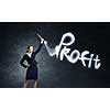 Businesswoman in darkness drawing profit word with flashlight