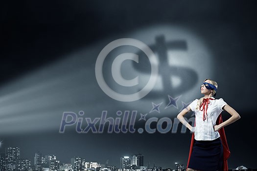 Young woman super hero and dollar sign in spotlight Young woman super hero and dollar sign in spotlight