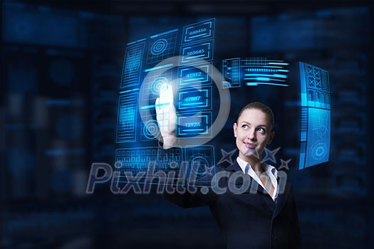 Attractive smiling businesswoman working with virtual panel interface Attractive smiling businesswoman working with virtual panel interface