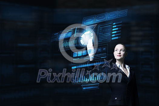 Attractive smiling businesswoman working with virtual panel interface Attractive smiling businesswoman working with virtual panel interface
