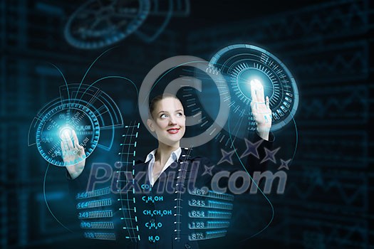 Attractive smiling businesswoman working with virtual panel interface Attractive smiling businesswoman working with virtual panel interface